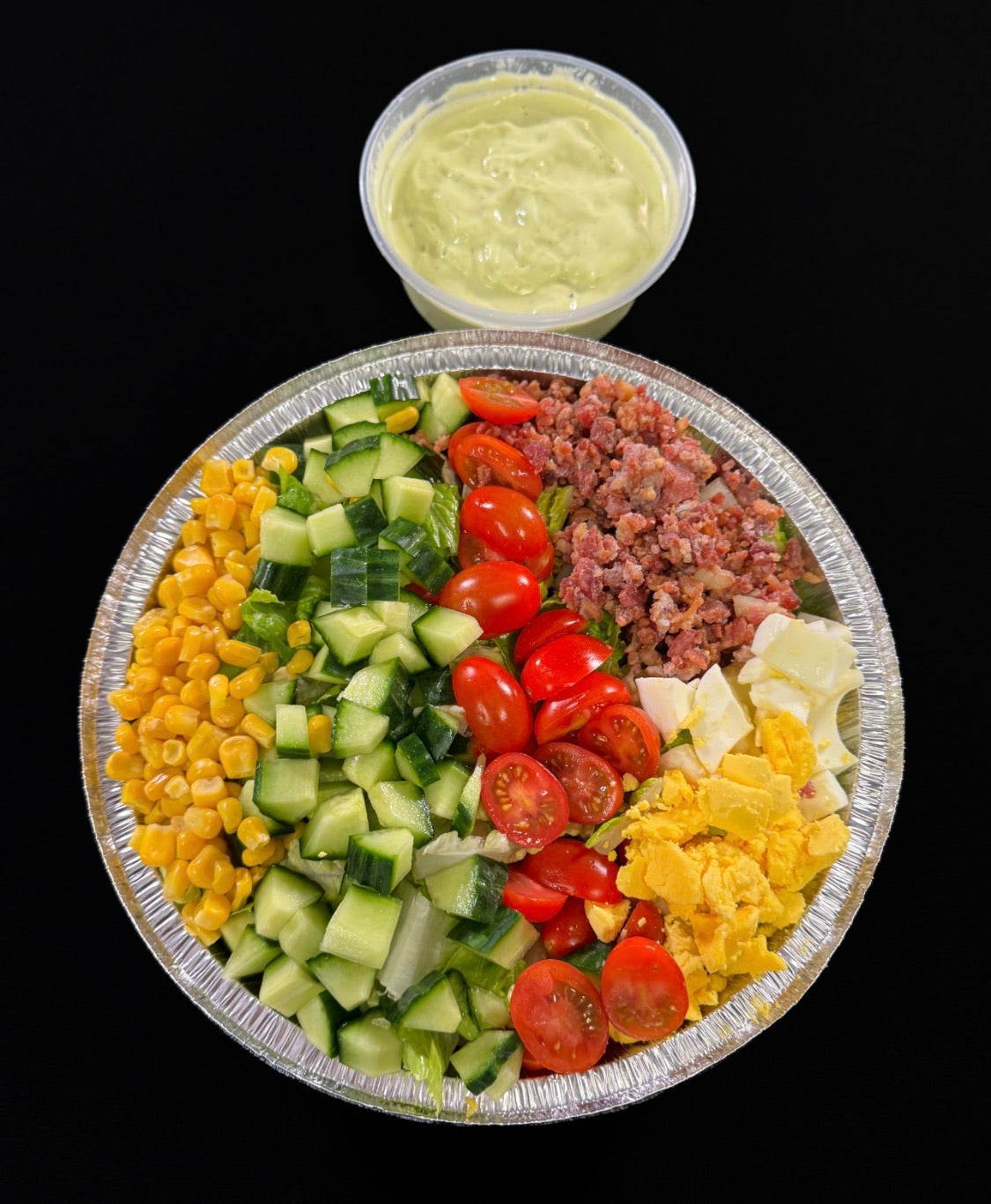 WO 10/4/26 - Cobb : Corn, Tomatoes, Cucumbers, Bacon, Hard Boiled Eggs, Croutons, Avocado Dressing