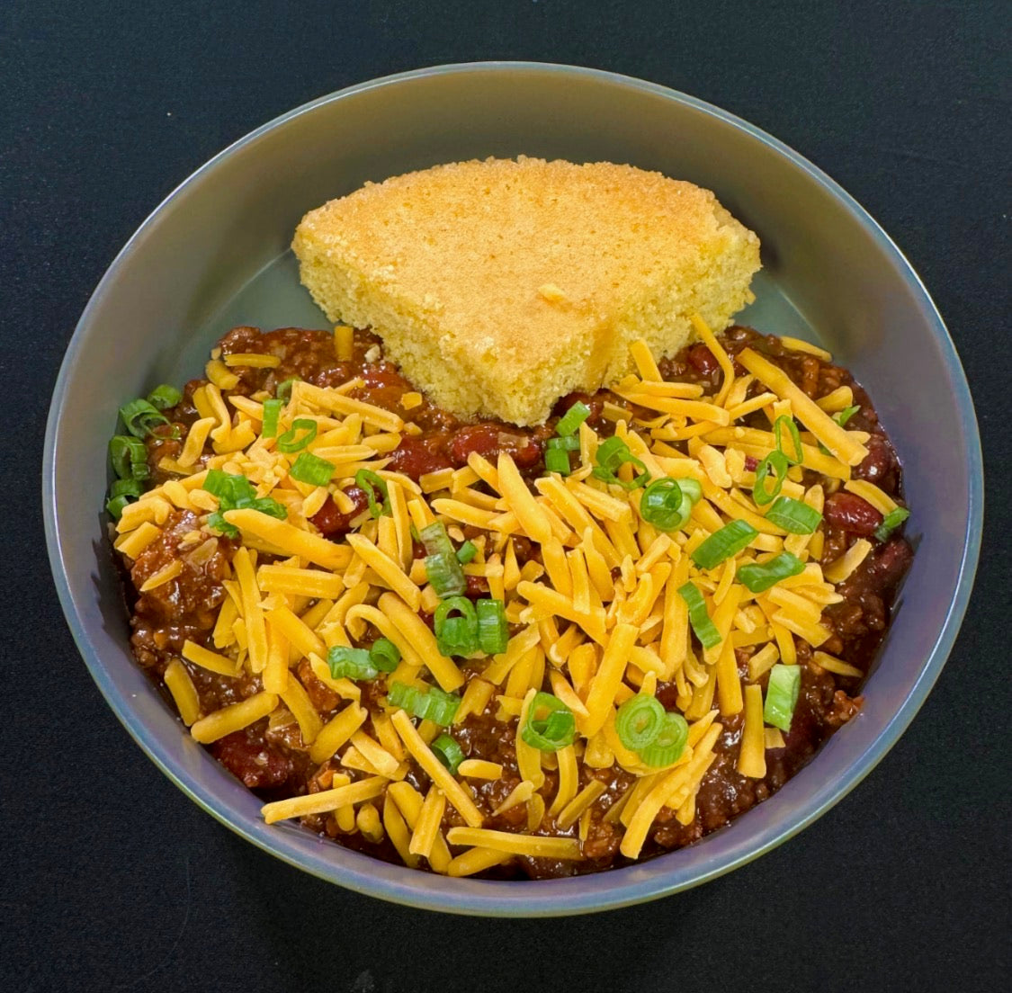 WO 10/4/26 - Southwest Chili w/ Kidney Beans Topped w/ Cheddar Cheese,  Scallions and Honey Butter Corn Bread